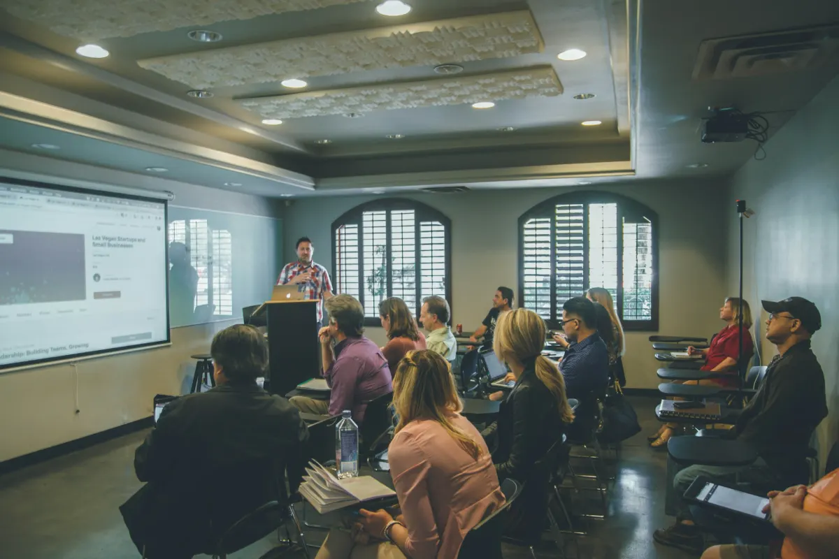 Group of people attending a presentation in a meeting room